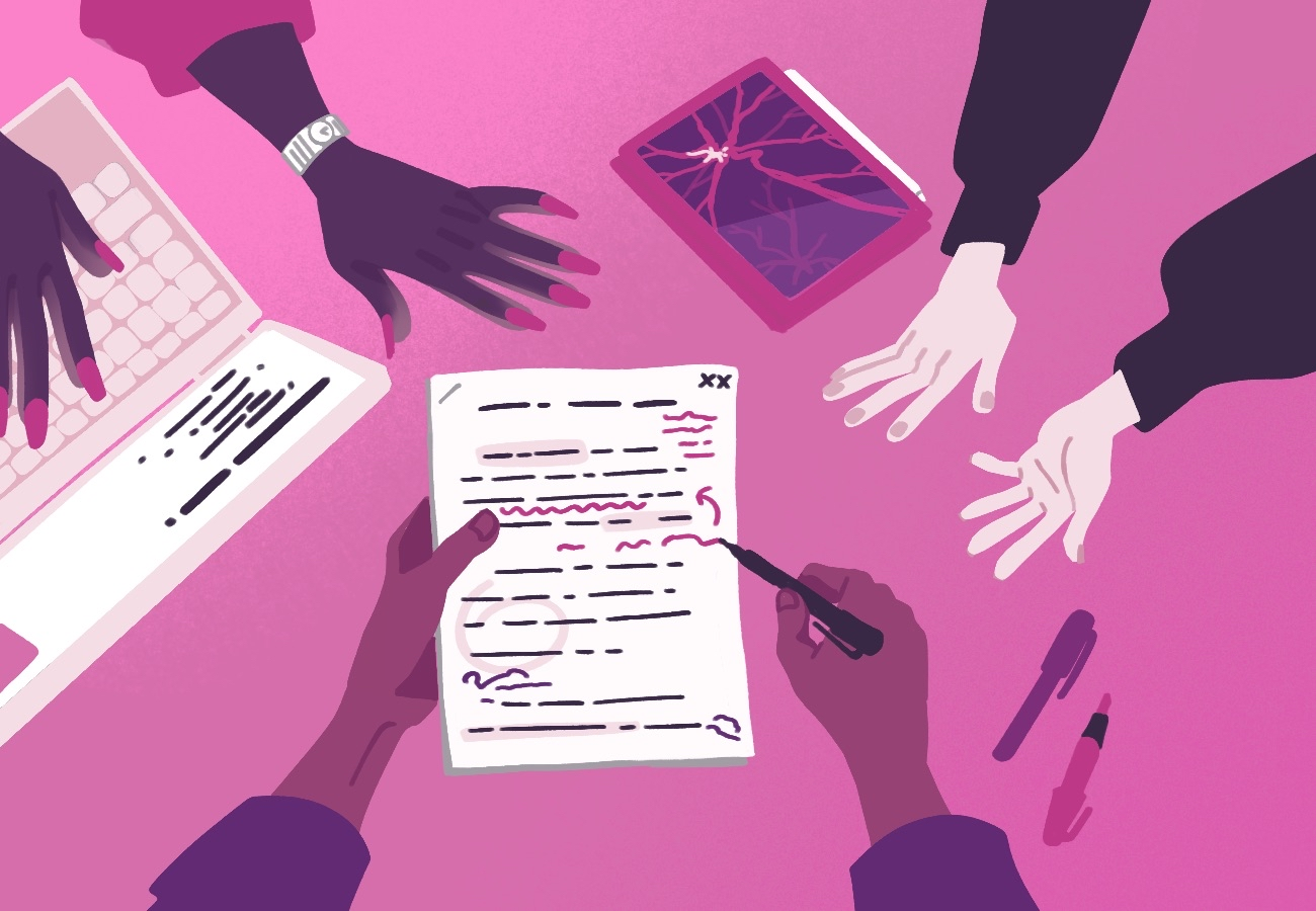 a group of three people collaborating, and editing an article