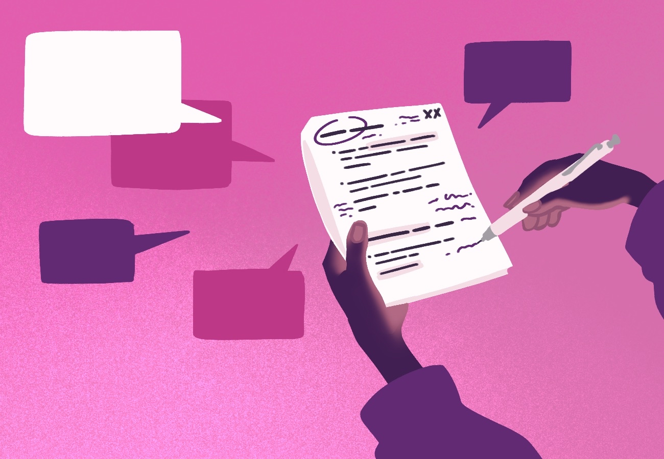 a person holding a paper while writing comments