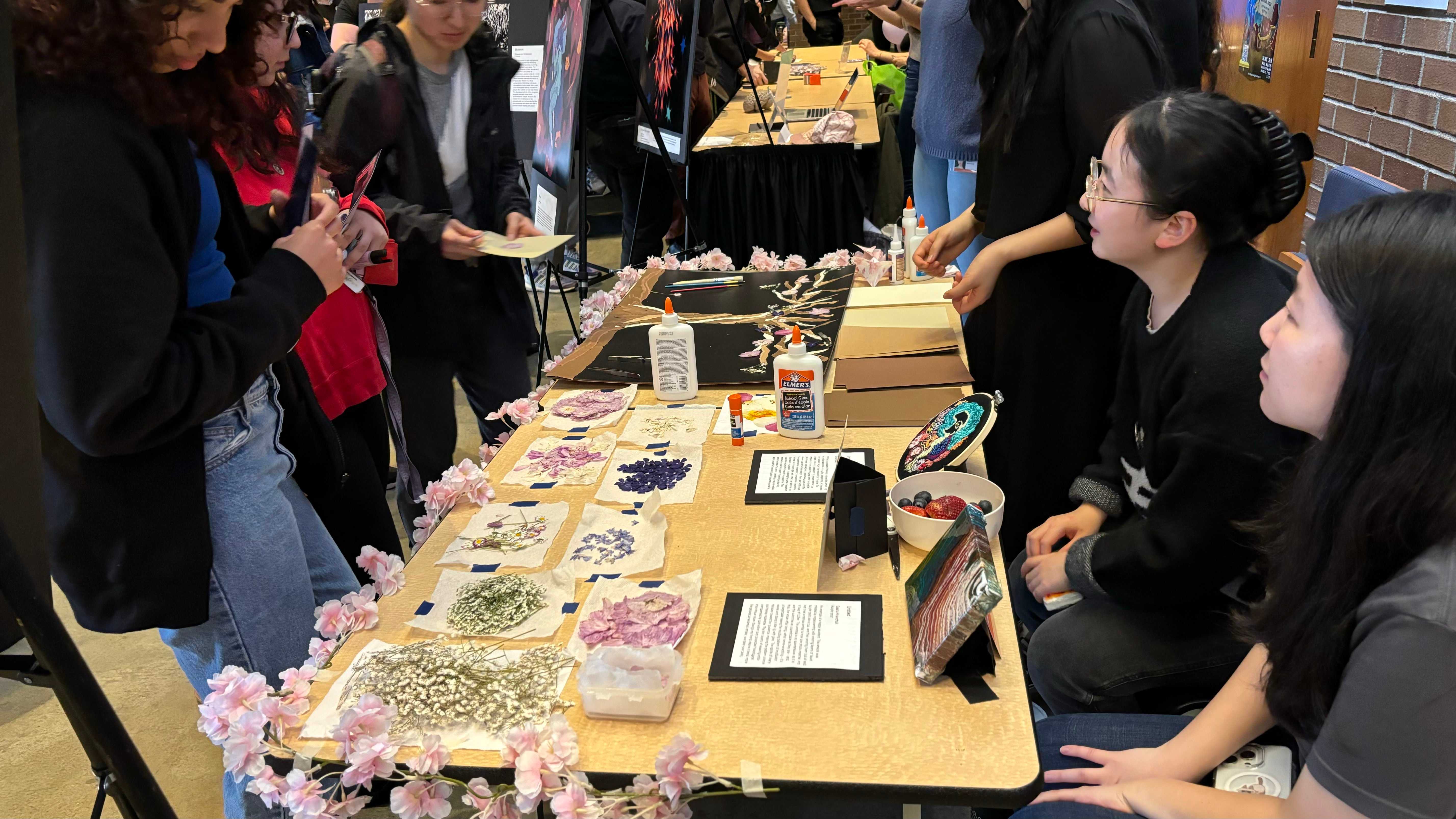 a member of the "outreach team" holding a hemisphere of a sheep brain